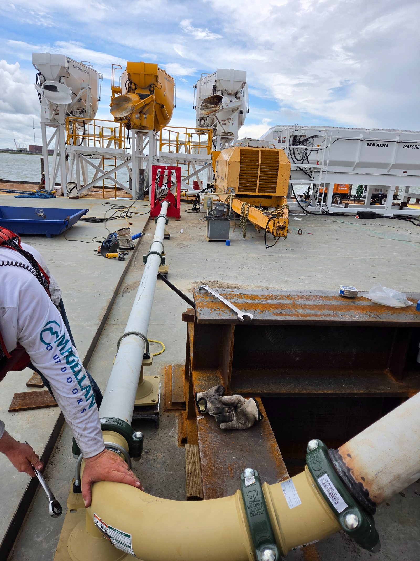 Bracketed placement line and hose running the length of a barge deck